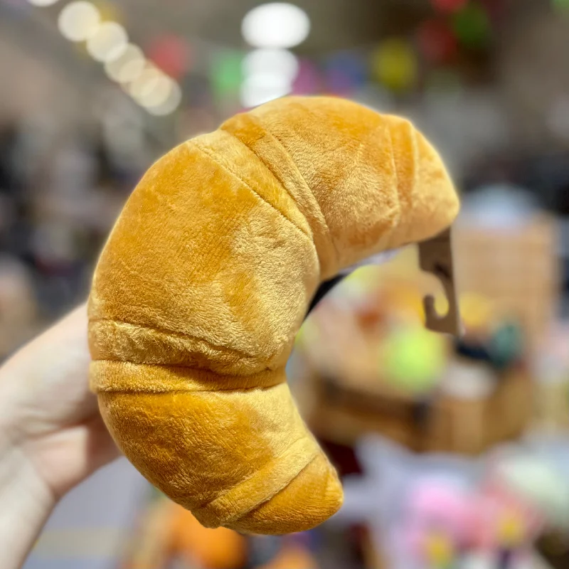 - Plush pet toy selectionP.L.A.Y. Croissant Dog Toy